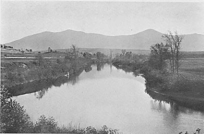A View of Mt. Bigelow with a river in the foreground.