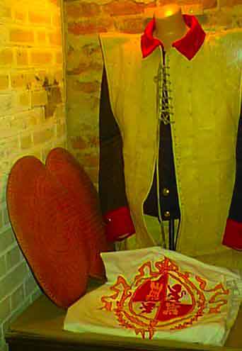 Historical uniform and hat on display, showcasing a glimpse into a military or ceremonial past.