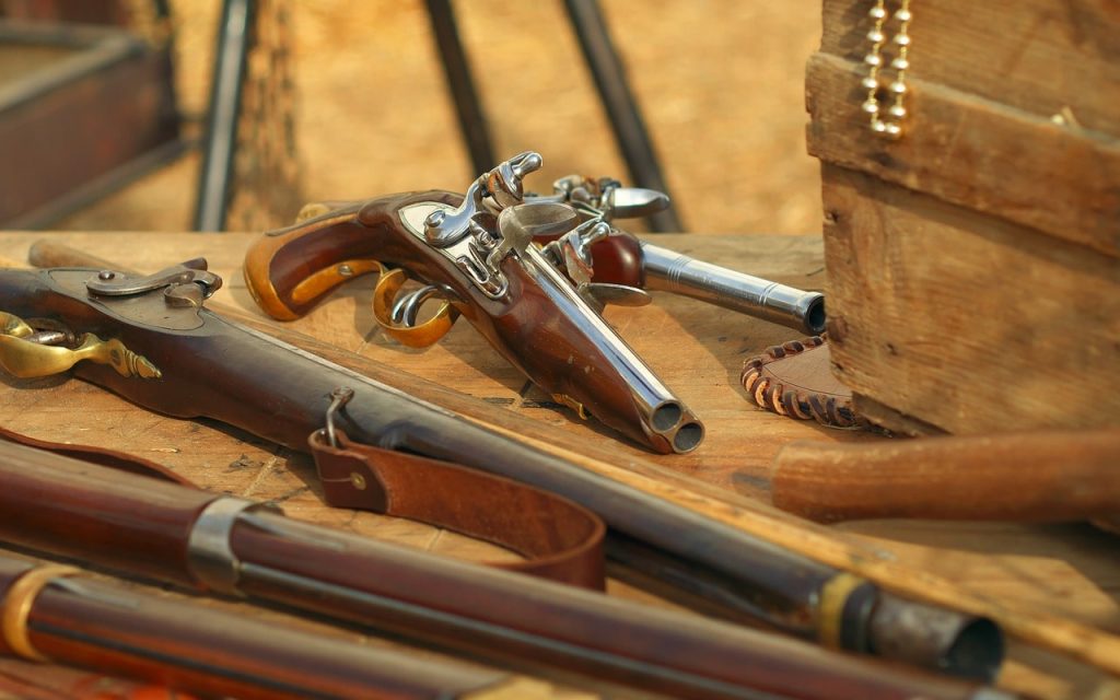 Flintlock pistols and muskets.