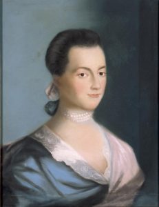A classic portrait of a woman from a bygone era, featuring a soft gaze, an elegant pearl necklace, and attire typical of 18th-century fashion.