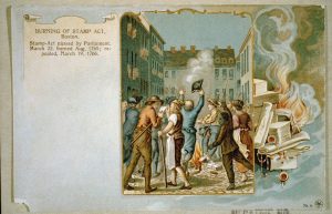 Political cartoon showing the burning of the Stamp Act in Boston in celebration of its repeal.