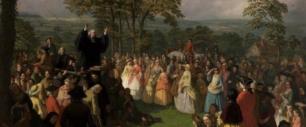 George Whitefield, an evangelical preacher, depicted preaching to a crowd during the First Great Awakening.